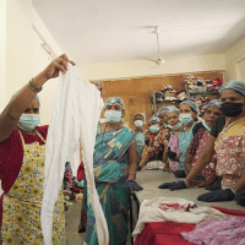 Women sorting reusable fabric for Punarsutra